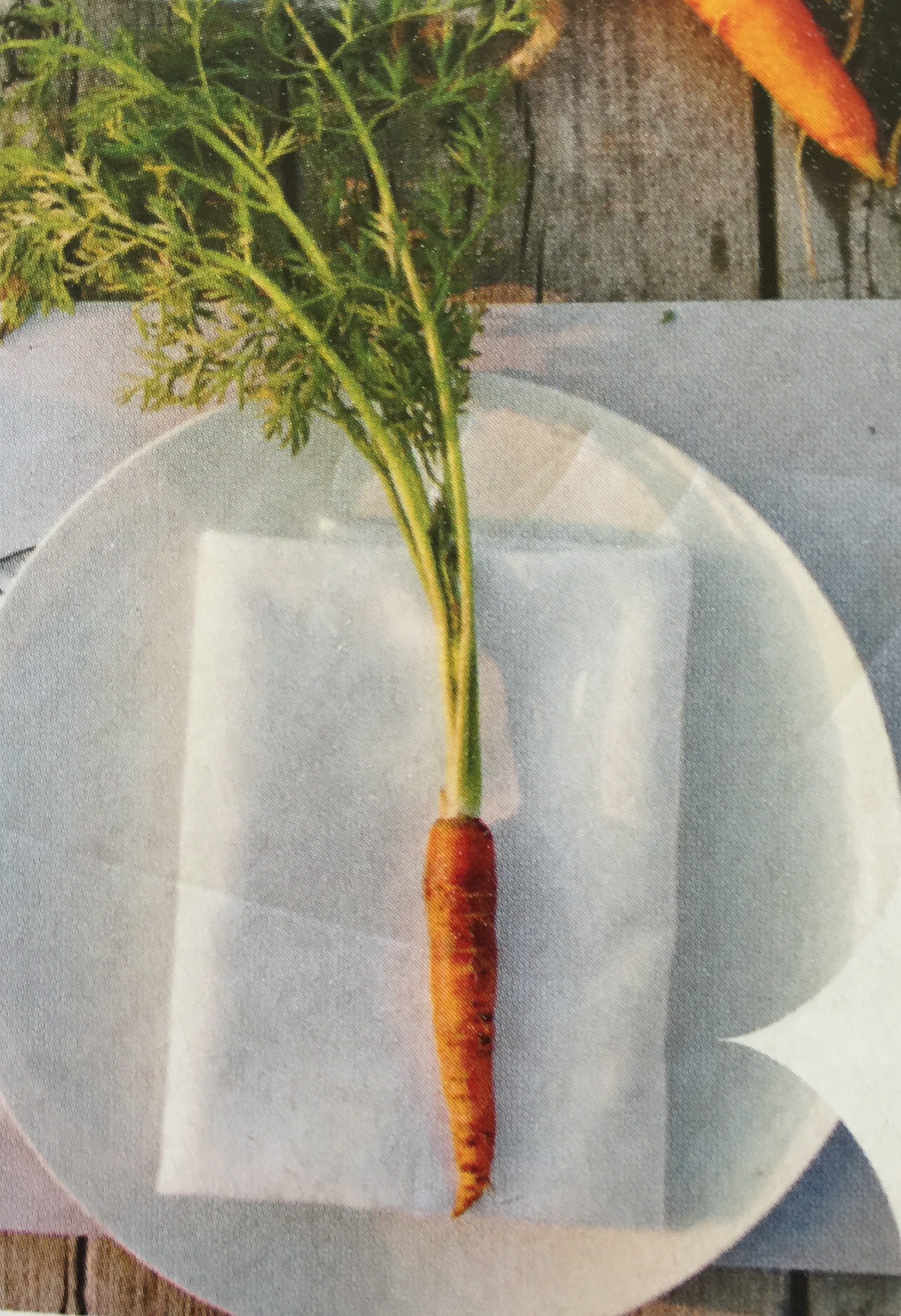 Bring an element from the centrepiece (in this case, vegetables) onto each place setting.