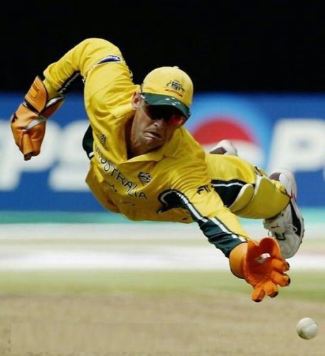 Adam Gilchrist dives for ball by Allan Cornell
